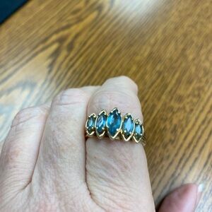 Elegant 14k gold and 5 stone blue topaz ring